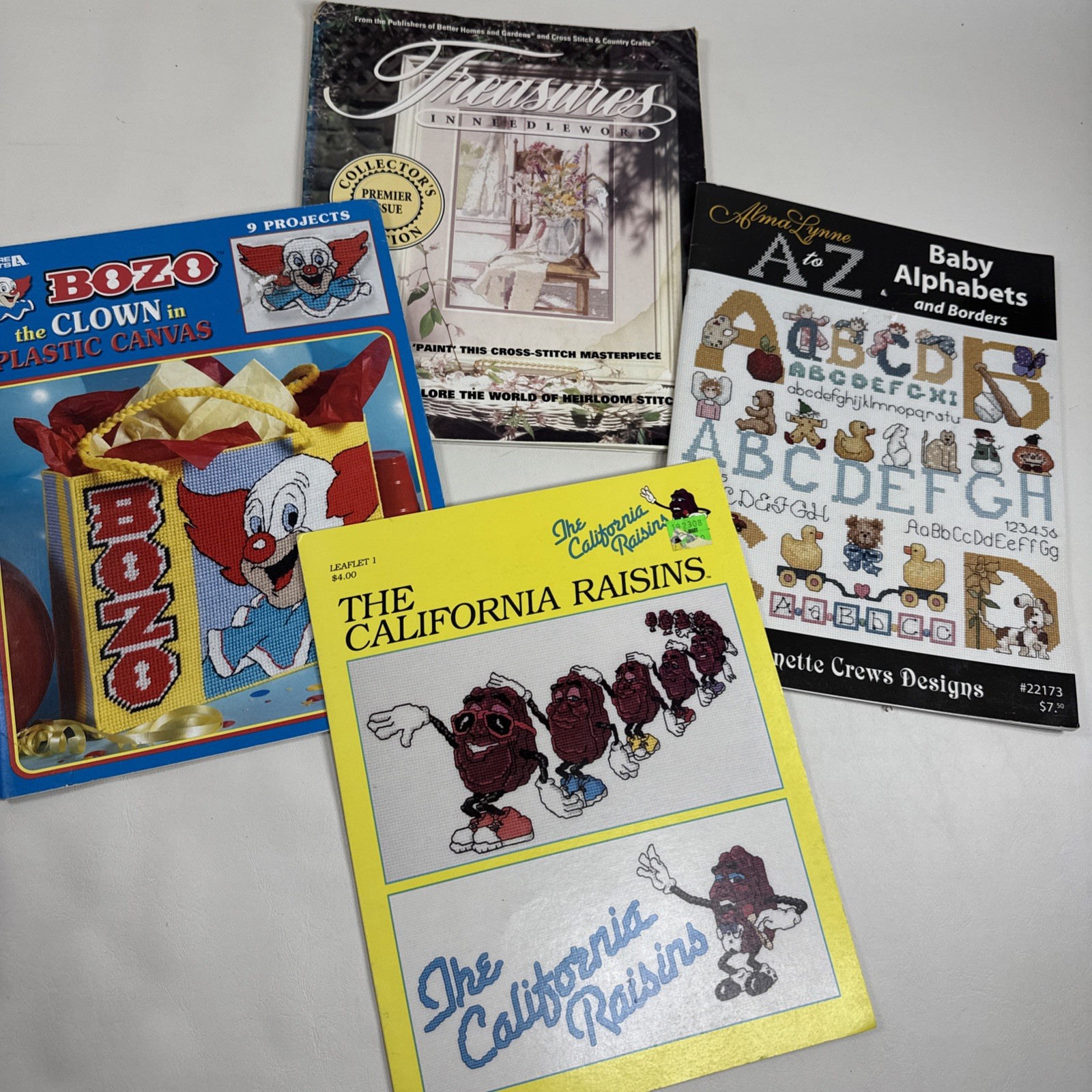 Book Lot of 4 Needle Work Project Books Bozo Clown California Raisins Alphabet